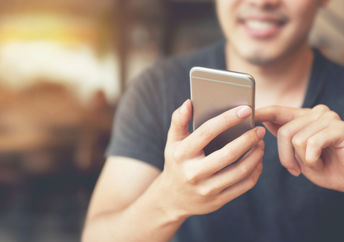 Man intrigued by his smartphone