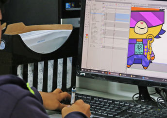 A young animator at work on his computer.
