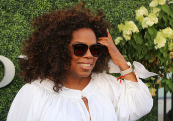 Oprah Winfrey gives college scholarships to four deserving young men.