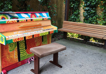 A piano in a park.