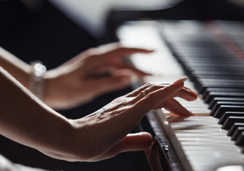 Playing the piano.