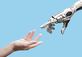 Human and robot hands symbolizing the link between people and AI