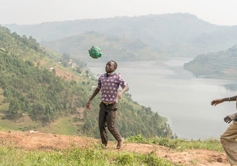 Playing with a homemade soccer ball.