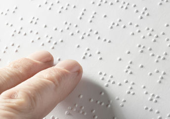 Blind person touching words.