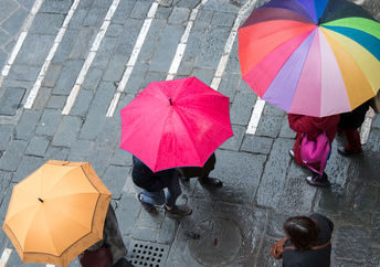 Pedestrians on a rainy day in the city.