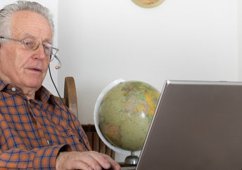 Senior man using Skype.