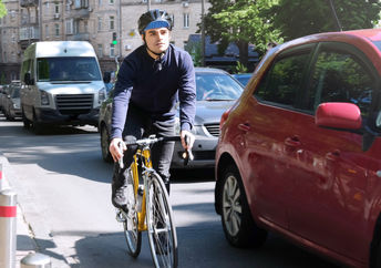 Man riding bicycle in the city.