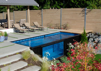 A home with a shipping container swimming pool.