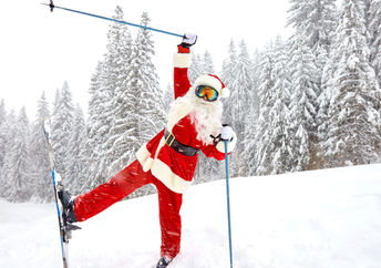 Santa skiing in the mountains over Christmas