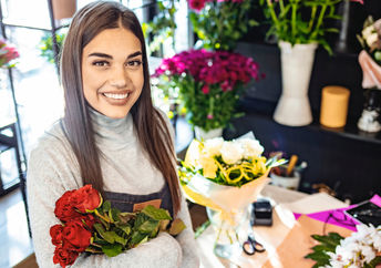 Young woman enjoying learning about flower arranging