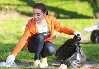 Cleaning a park on Good Deeds Day.