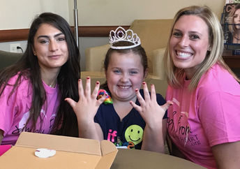 This patient is getting her nails done by the glam squad.
