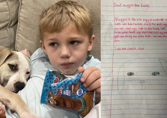 Roman and Maggie next to one of the letters.