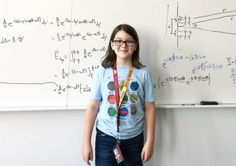 Elliott Tanner presents a physics calculation.