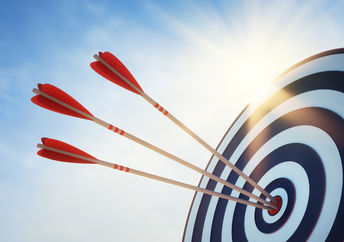 Hitting the target with arrows.