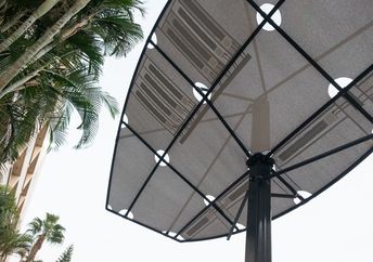 LumiWeave fabric shades by day and uses sun to light at night.