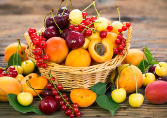 A basket full of summer fruit.