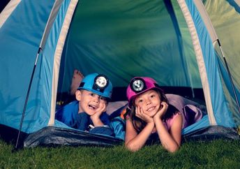 Kids camping in their backyard.