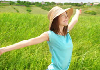 By being outdoors, a healthy woman is nurturing her skin microbiome.