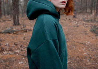 A woman wearing a hoodie.