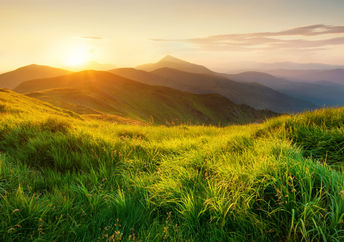 Mountains during sunset in a beautiful natural landscape in the summertime.