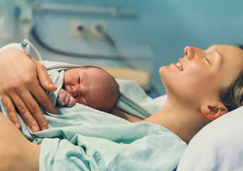 Newborn baby with mother