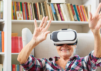 Senior citizen enjoys using VR glasses
