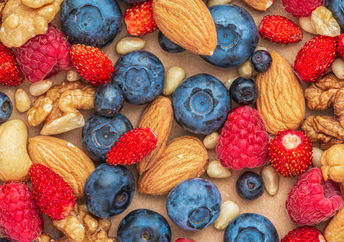 Nuts and berries are healthy foods to eat daily.