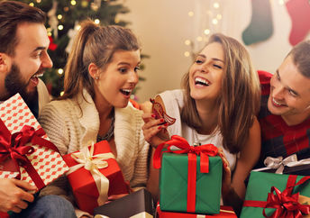 A group of friends celebrate by giving a consumable gift.