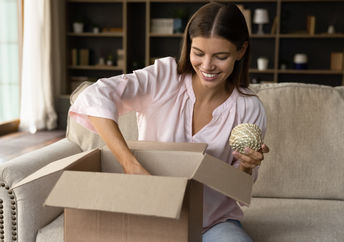 Opening a box with products.