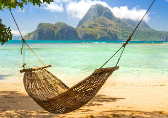 A hammock on a tropical island.