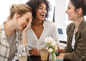 A group of friends talking and laughing.