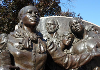 Statue of Harriet Tubman leading slaves to freedom in the north.