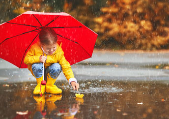 Playing in the puddles during a springtime rain.