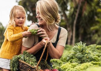A mother and child in an organic garden.