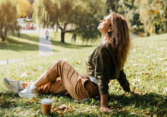 Woman relaxing in nature during her lunch break.