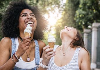 Two friends enjoying ice cream.