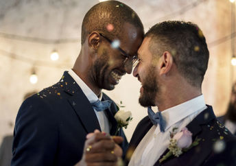 Two grooms at their same sex wedding.