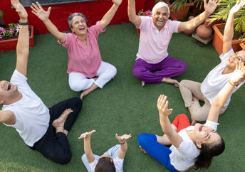 a group of people doing laughing yoga.