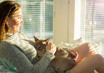 Woman in sunny room.
