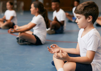 Students learning mindfulness in school.