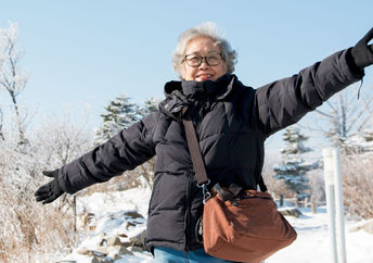 Senior woman traveling through South Korea.