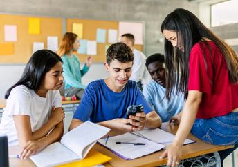 Teens using cellphones during school.