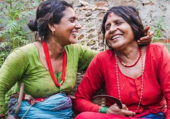Happy Nepali women in traditional attire.