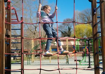 A child playing in an urban park.