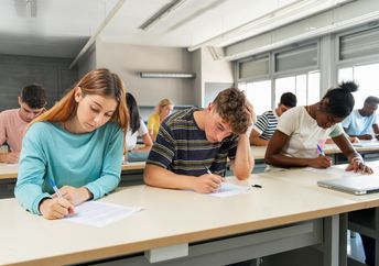Students taking an exam.