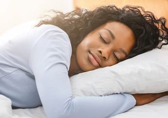 A young woman is getting restful sleep.