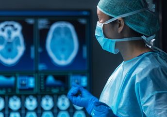 A team of medical doctors perform a surgical operation.