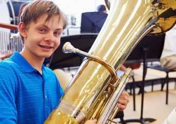 Student playing a tuba.
