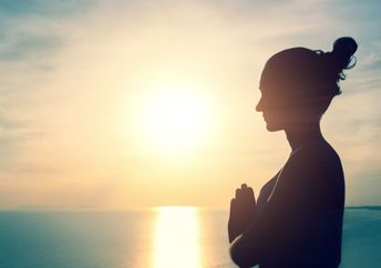 Woman meditating in nature.